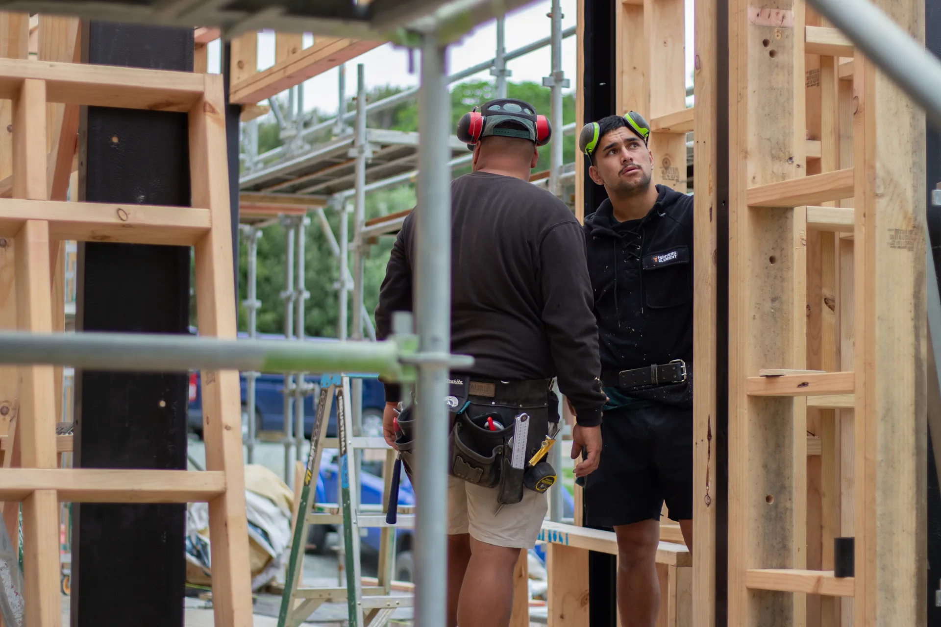 NF Construction builders collaborating on site